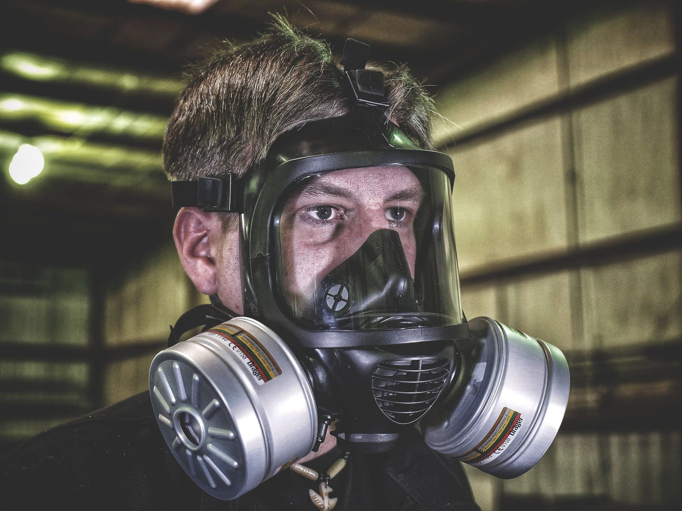 Side view of a man wearing the CM-6M tactical gas mask